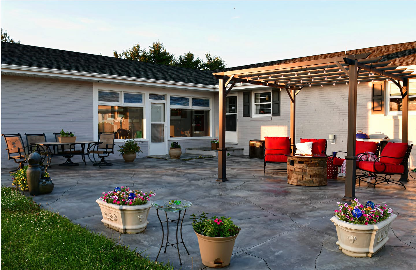 Aerial view of outdoor kitchen with concrete patio by Trademark Outdoor Services